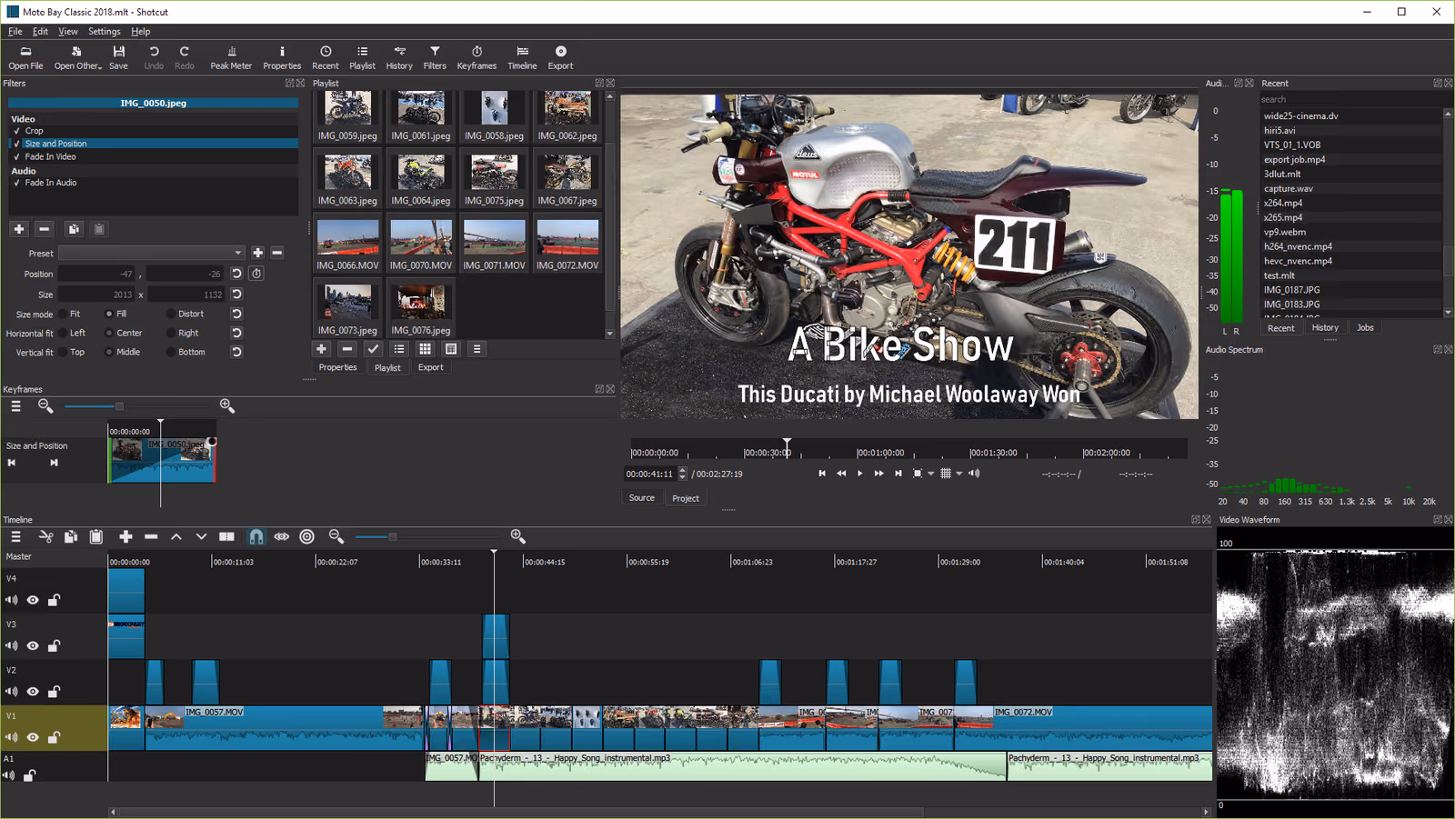 Shotcut editing a motorcycle show video: filters and a playlist on the left, the preview in the middle, audio meters and a video waveform on the right, and a four-track timeline